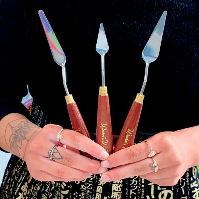 Warhol's Wife Palette Knives being held by Artist